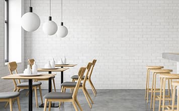 Cafeteria with wooden furniture in grey and white industrial design