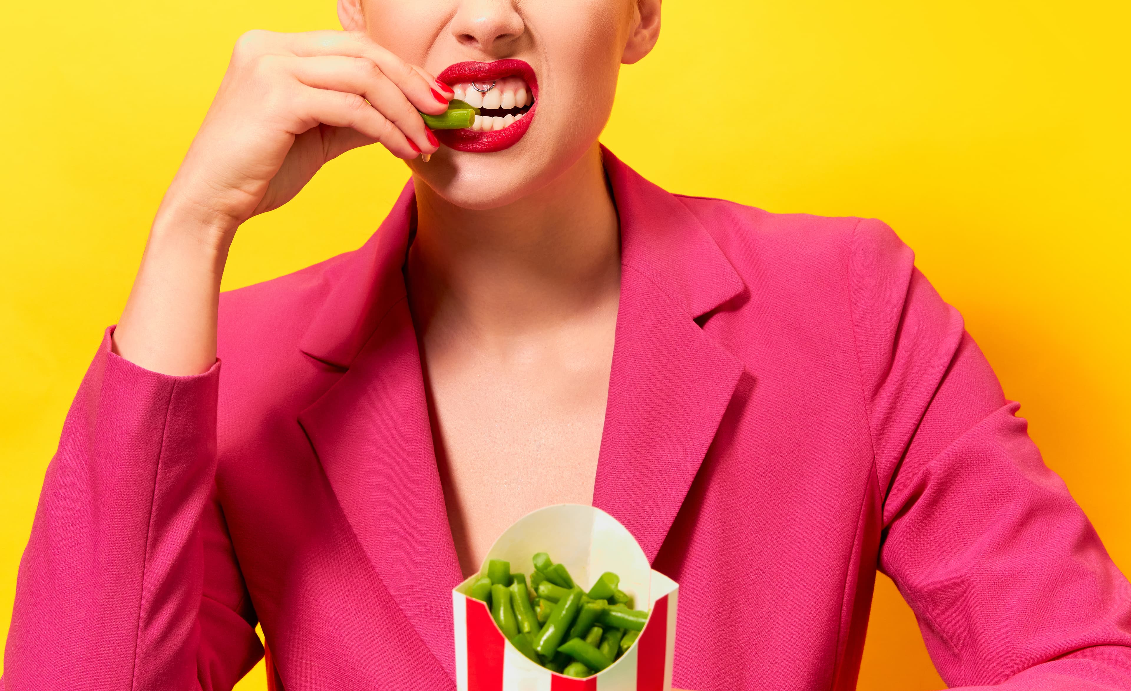 Woman biting into beans