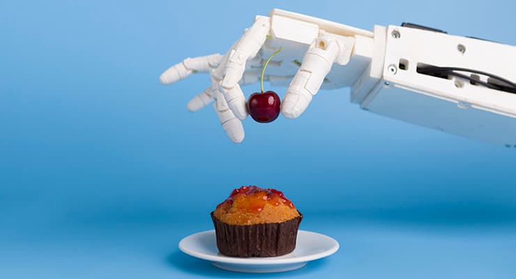 Robotic arm puts cherry on cupcake